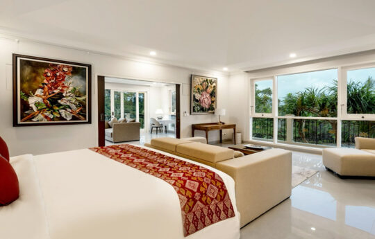 Modern bedroom with king bed and artwork