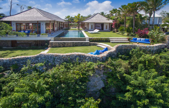 Majestic cliff top villa views from above with infinity swimming pool and garden area