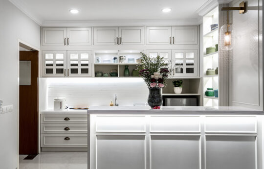 well equipped kitchen and island dining bench