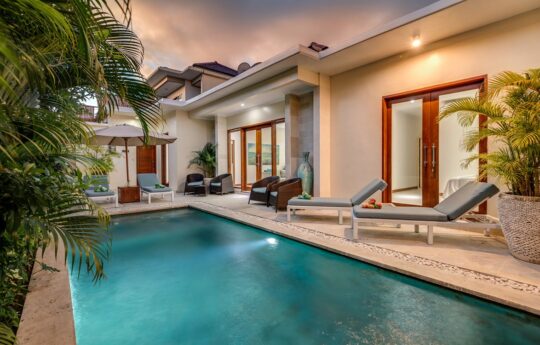 Villa Luxe Villa Luxe Swimming Pool with villa exterior views at dusk with 2 day beds