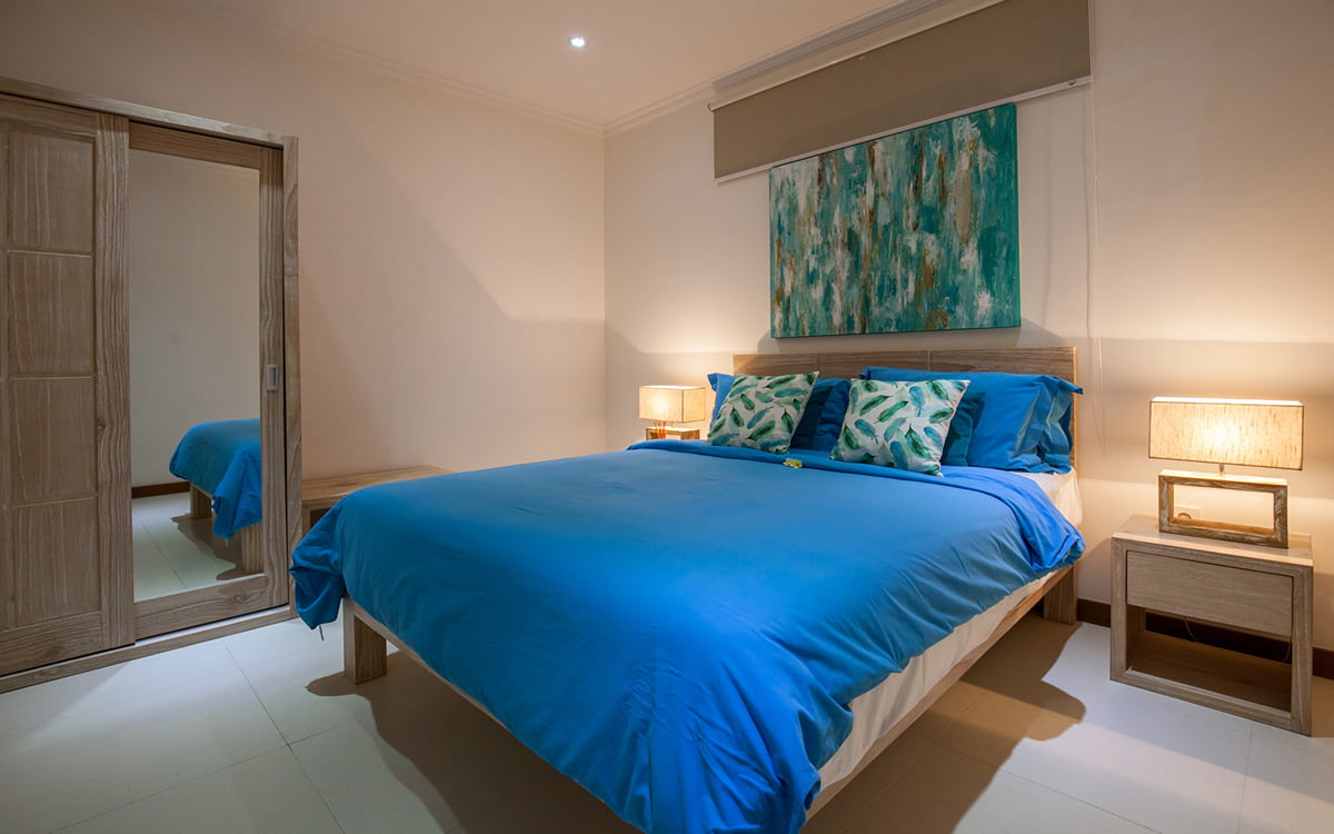 Bedroom of villa with ensuite bathroom