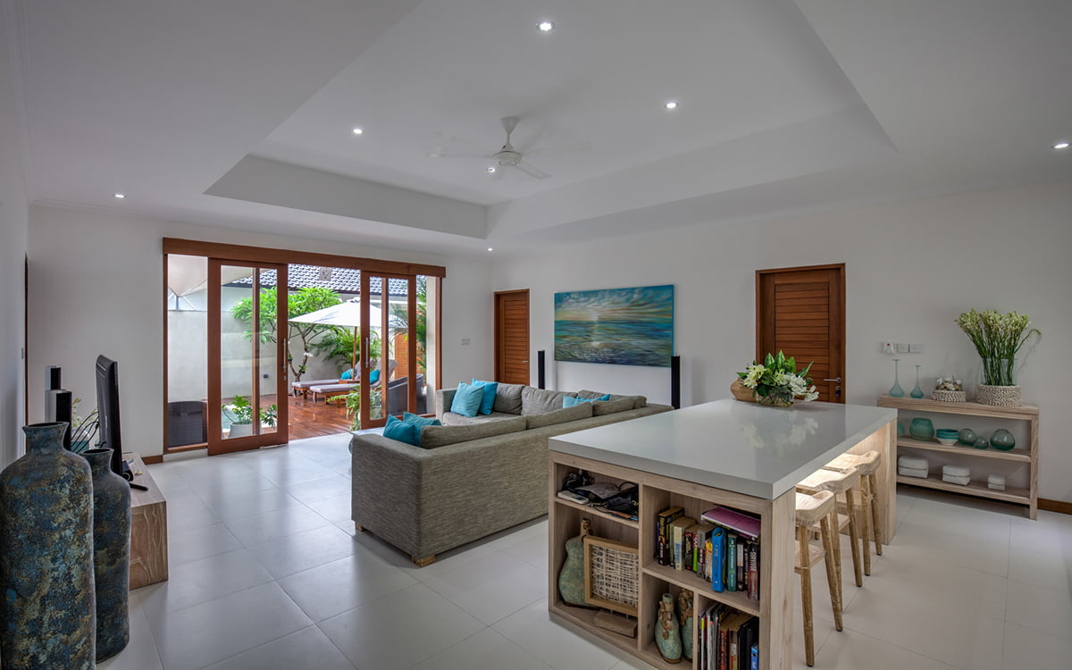 Open plan living and dining area of villa with dining table