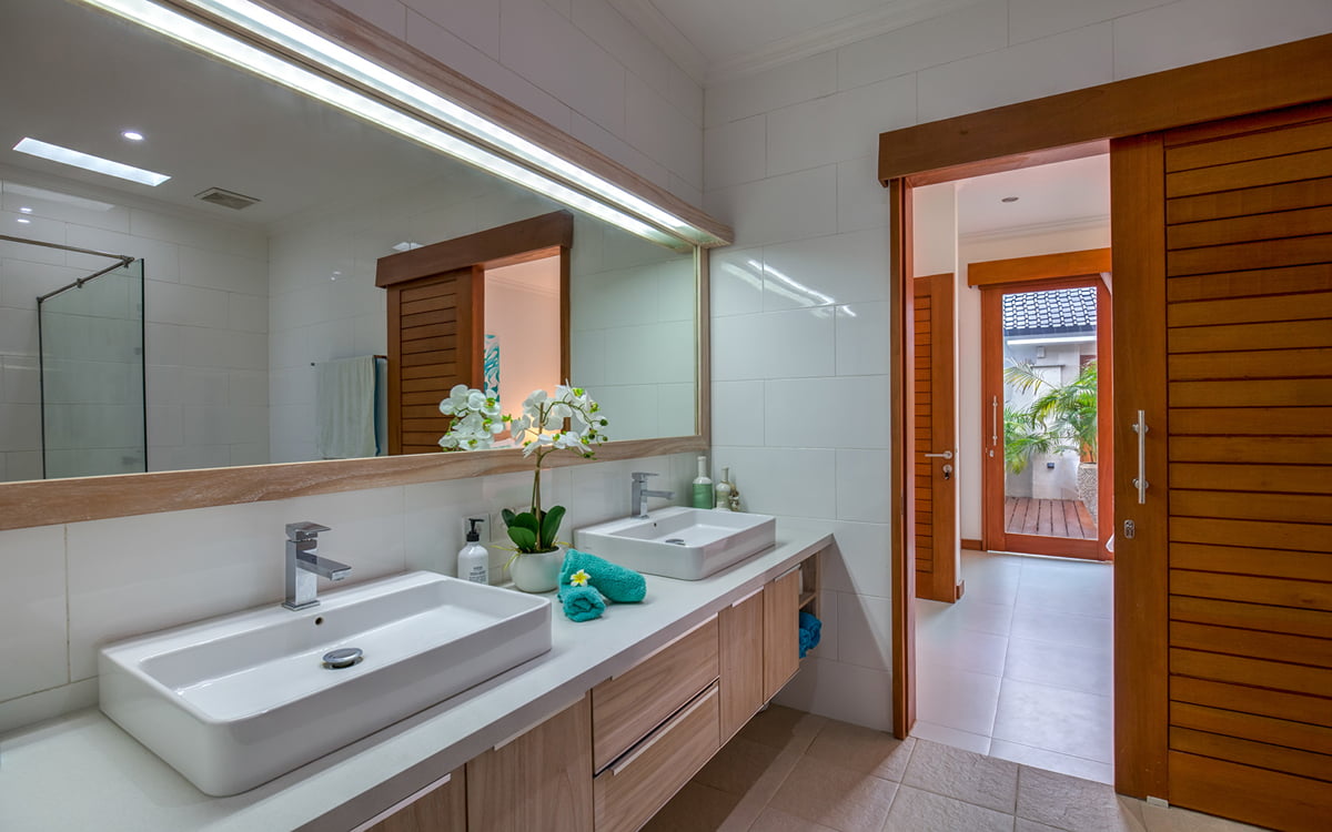 Ensuite bathroom of villa with twin vanities