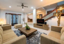 Lounge area of villa with two sofa and flat screen TV with netflix logo