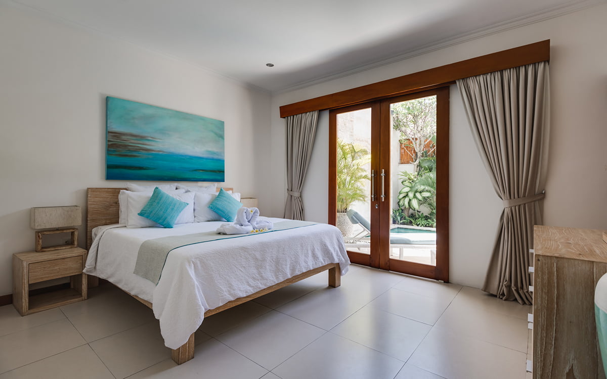 Bedroom on villa with view to swimming pool
