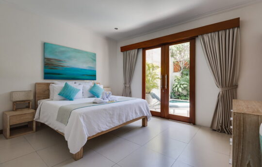 Bedroom on villa with view to swimming pool