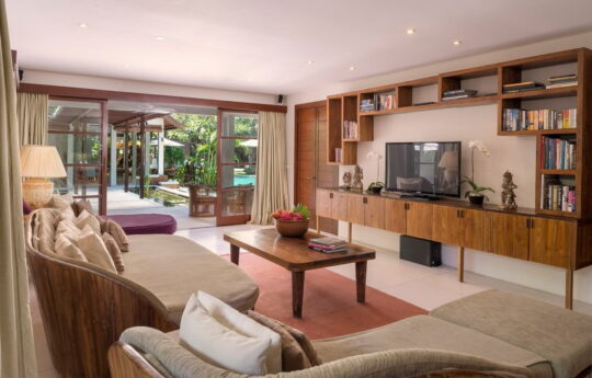 Modern loung are TV area of villa with sofa and view to garden