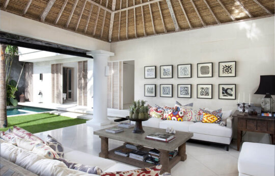 Lounge area of villa with 2 sofas and coffee table