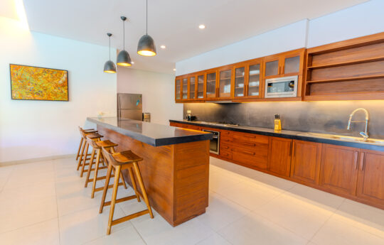 Modern kitchen with breakfast island bench with bar stools