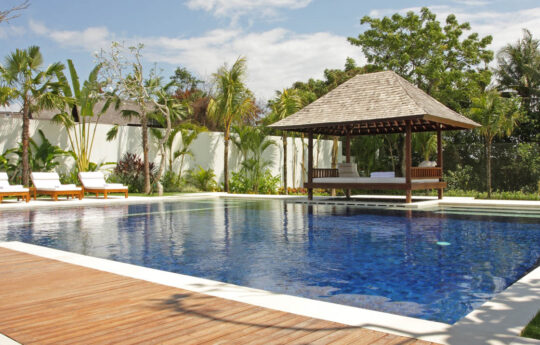 Pool and deck area of villa with outdoor gazebo