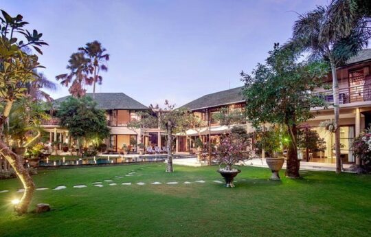 Villa Avalon Large garden area of Villa Avalon with trees and villa exterior