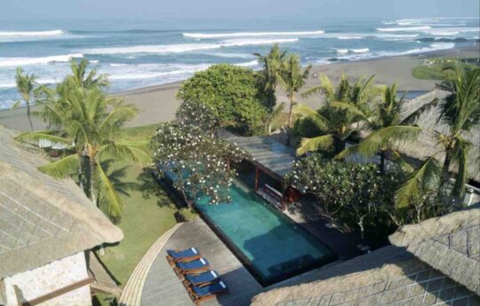 swimming pool views and Bali surf as backdrop on clear day