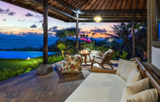 sofa and terrace area with swimming pool and beach views
