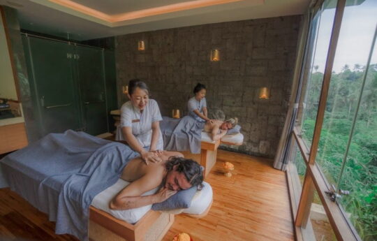 best day spas ubud Couple in a day spas laying down on bed having massage