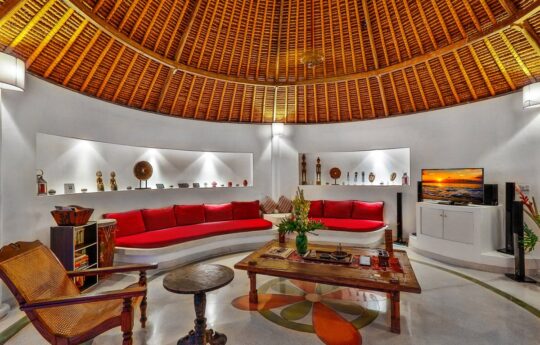 Lounge area of villa with chairs and coffee table