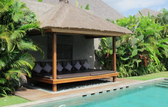 Outdoor cabana area next to pool