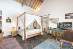 Book Villa Damai Manis - contact Bali Villa Escapes Lovely comfortable bedroom with artwork on walls and bed