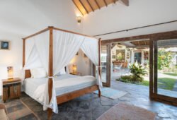 Book Villa Damai Manis - contact Bali Villa Escapes Modern bedroom with queen bed and views of garden
