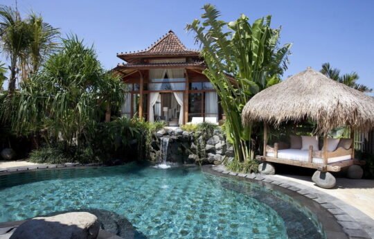 Villa_Amy_Canggu Swimming pool, gazebo and Villa Amy during the day with blue skies
