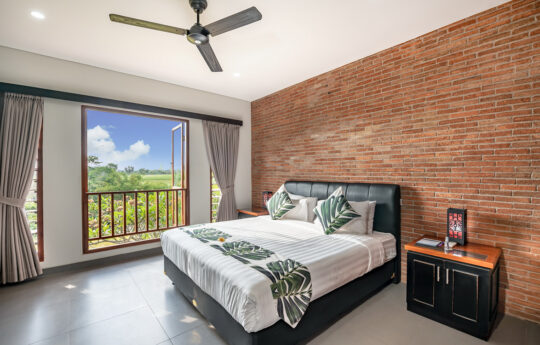 King size bed with view to rice fields