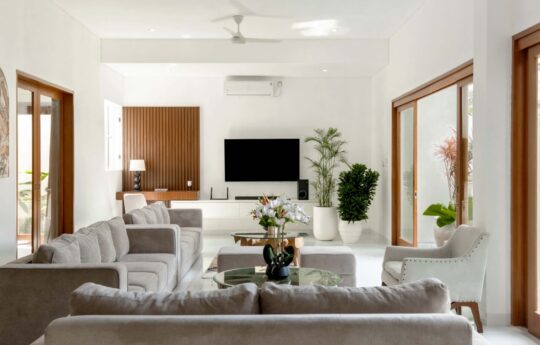 L shaped sofa in living room with flat screen TV