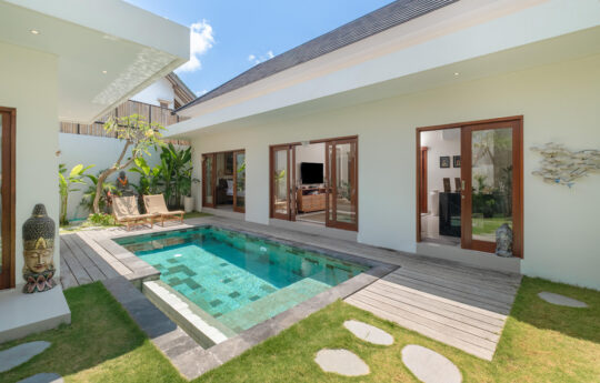 Swimming pool of villa lange in Seminyak with villa exteriors and garden area