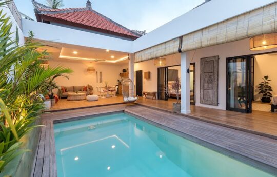 Villa Greco Villa Exterior of Villa Greco with pool and garden during late afternoon