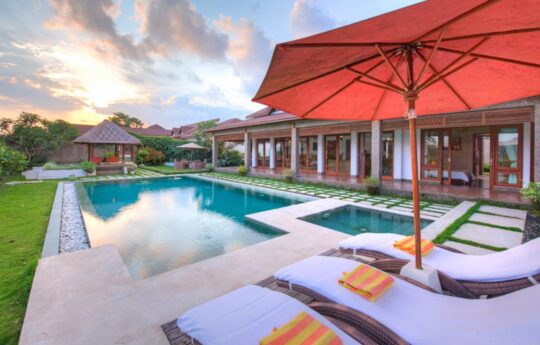 Villa Griya Aditi Pool views and villa exterior of Villa Griya Aditi with Ubud skyline
