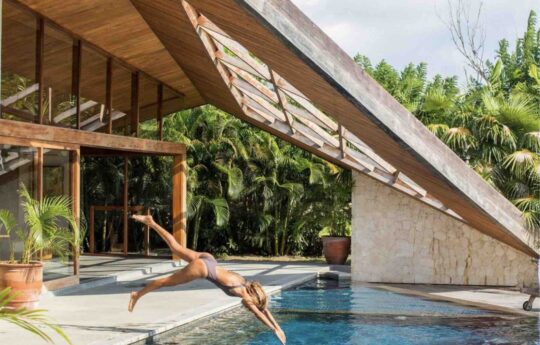 Person diving into swimming pool