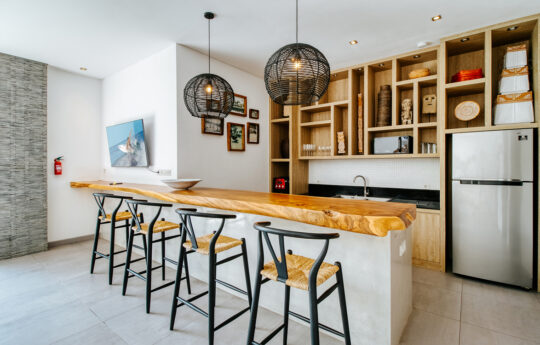 Modern kitchen with breakfast bar with four stools