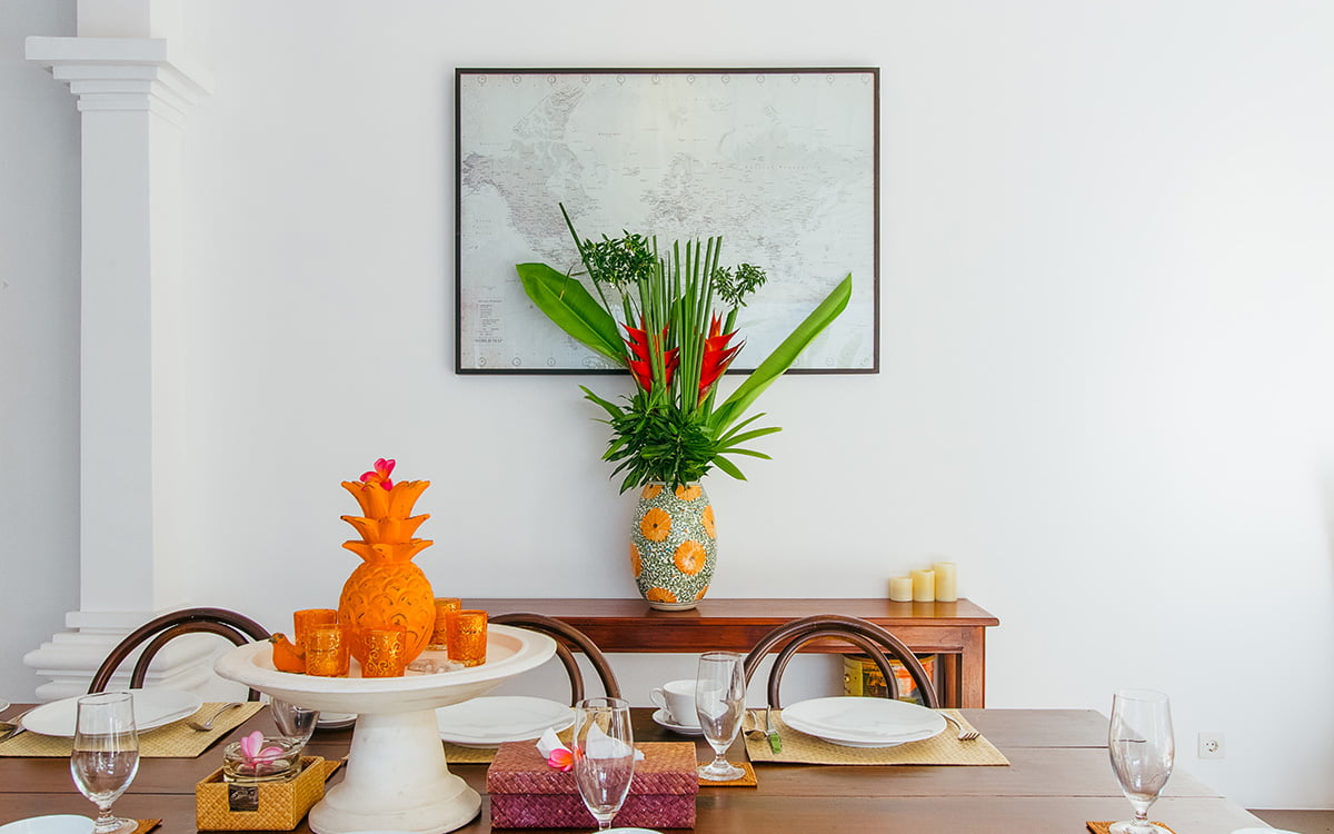 Dining table with artwork in background