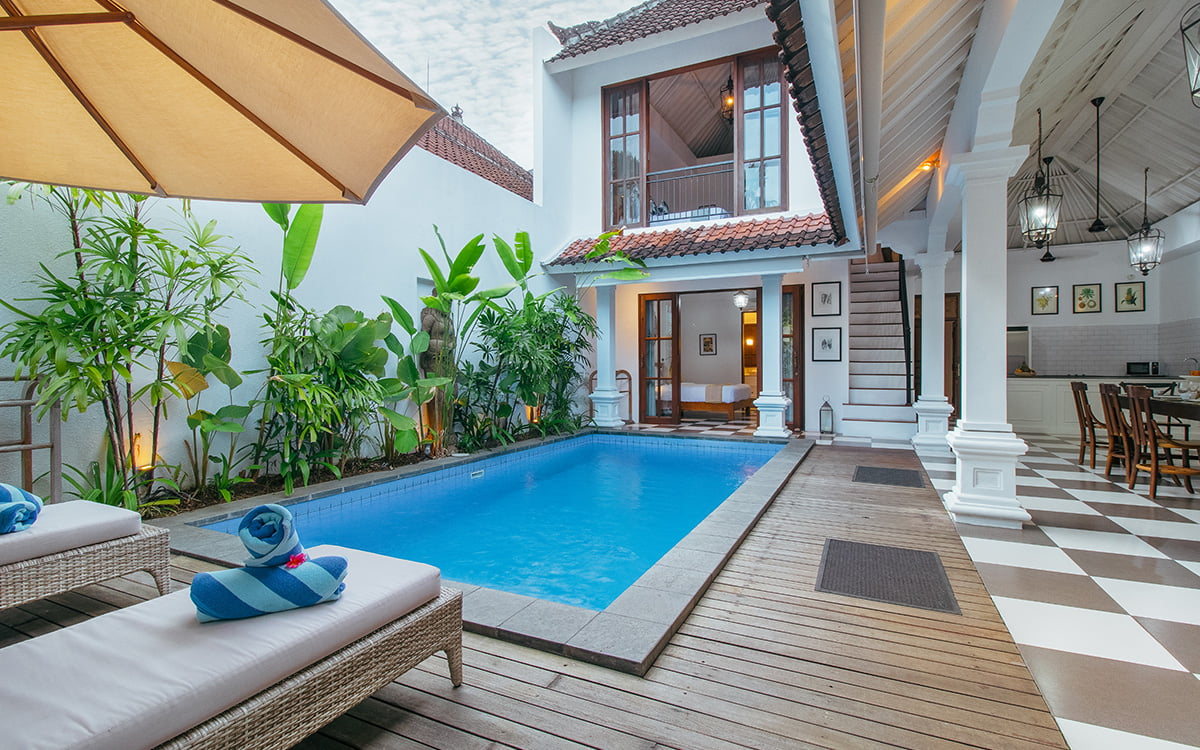 views of swimming pool and second level of villa