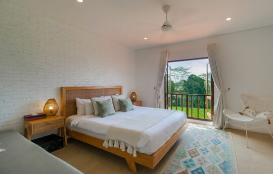 Bedroom with king bed and views to rice fields