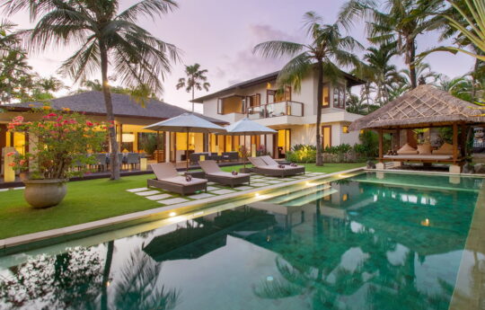 Villa Josuloma villa josuloma swimming pool area at dusk with palmtrees in background