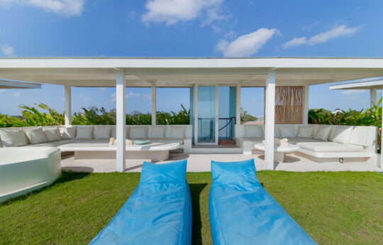 Cabana area with day beads and grass area