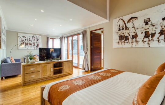 Bedroom with king bed and flat screen tv