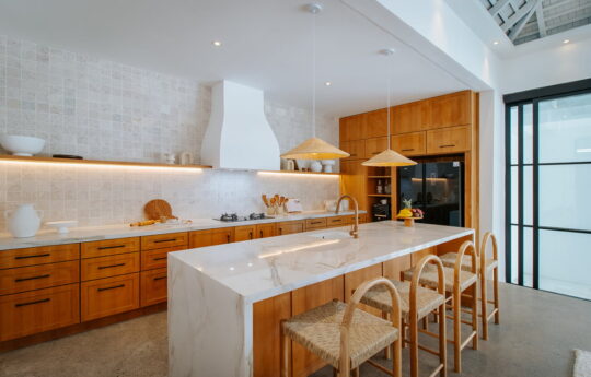 Modern kitchen with breakfast island bar and seating for three people