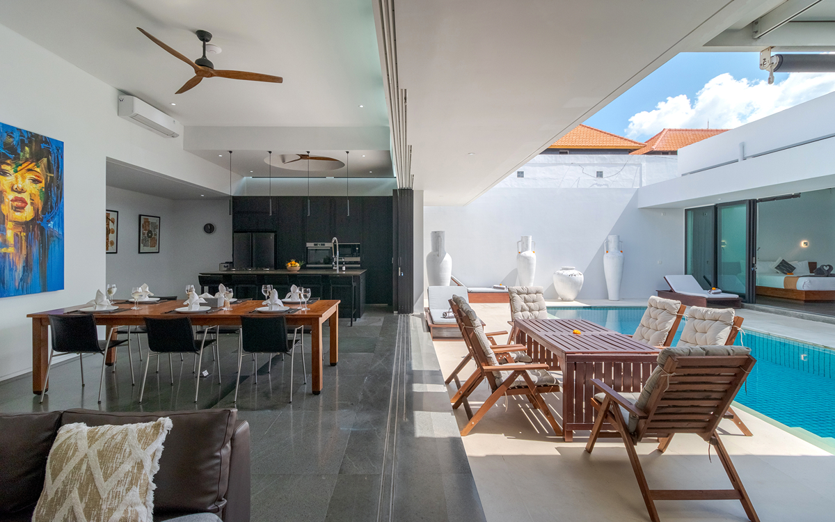Indoor and outdoor areas of villa with pool glimpses