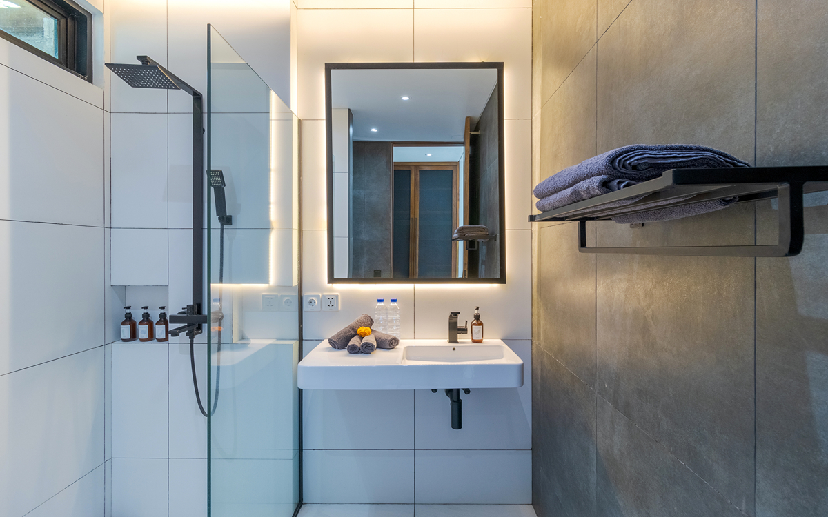 Luxury en suite bathroom of villa with vanity and shower