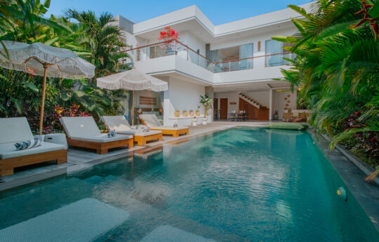 Villa Noya View of the pool and garden area of Villa Noya with entire 2 level villa in background