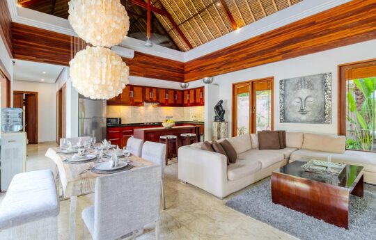 Villa living room with kitchen and dining table