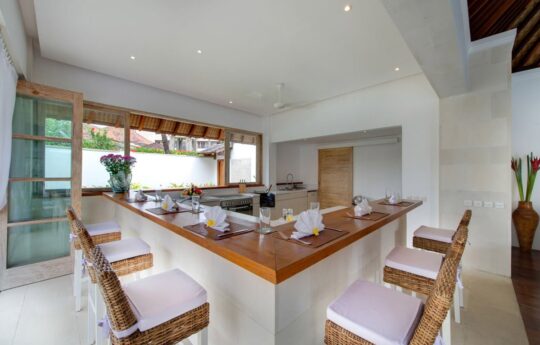 Kitchen area of villa with bench stools