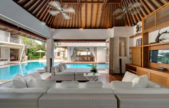 Spacious lounge room with view to pool