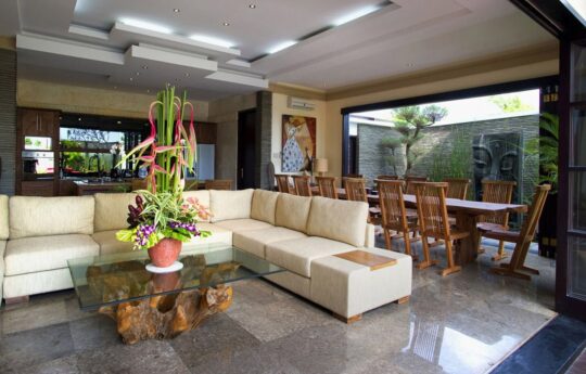 Living and dining areas with l shaped lounge