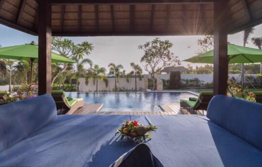 Villa Luwih View of Villa Luwih's swimming pool area from the gazebo at sunset