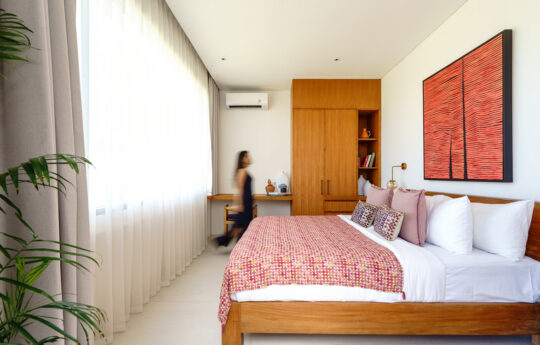 queen sized bed of villa with air conditioning