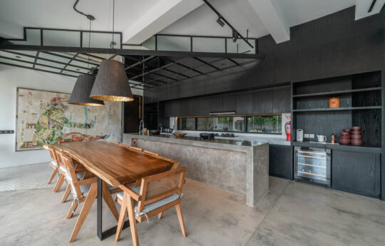 Modern kitchen of villa with dining table