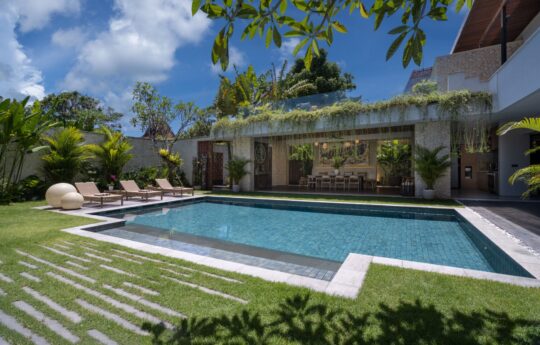 Villa Pantai Indah Swimming pool and villa's exterior vistas with garden and tress