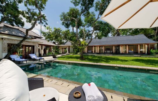 Villa exteriors among the garden area with swimming pool