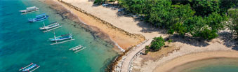 view of sunny sanur beach area with golden sands from above